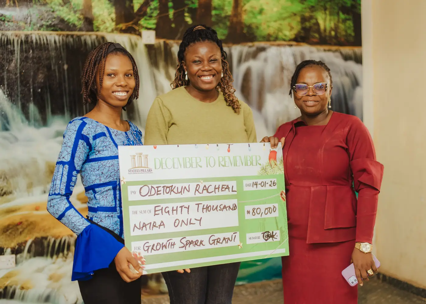 A recipient with the team and her grant