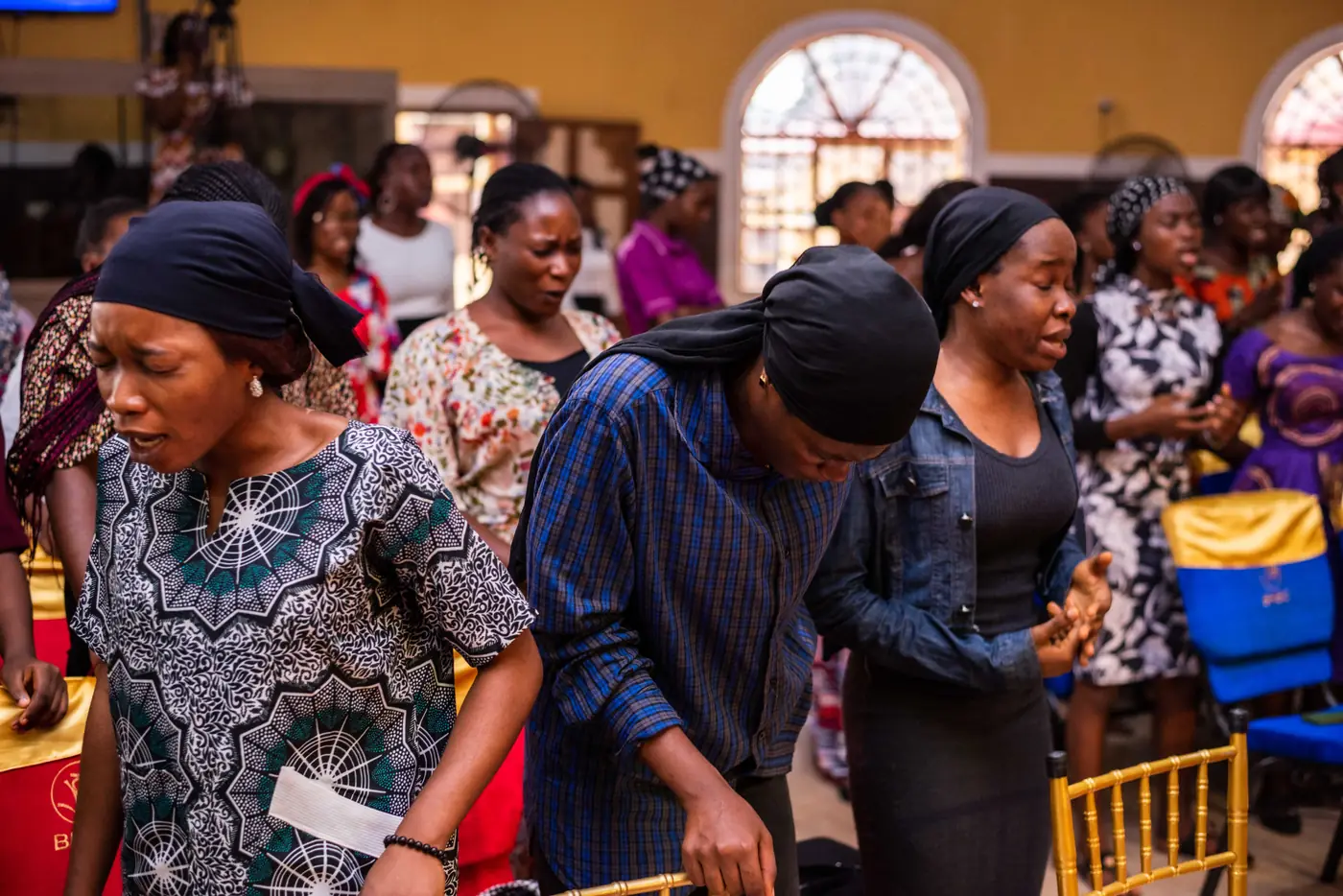 Women standing in prayer