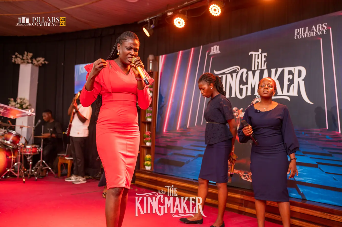 Ministers on stage in front of The Kingmaker backdrop
